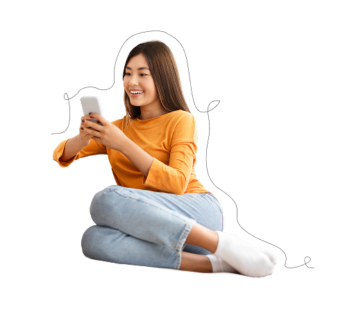 woman sitting and looking at phone