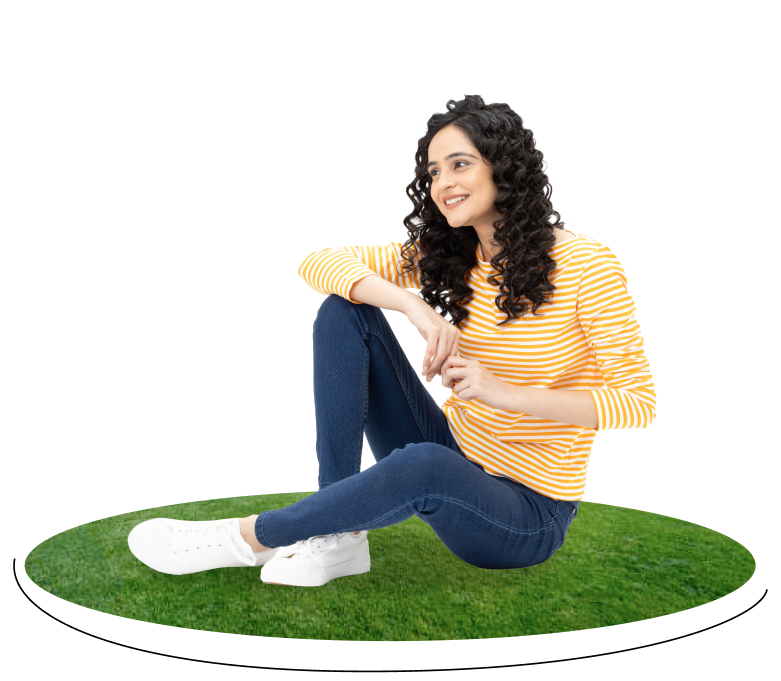 girl sitting down on grass