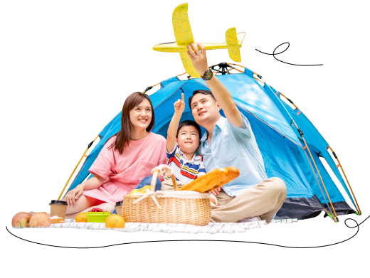 Family playing with an airplane next to a tent